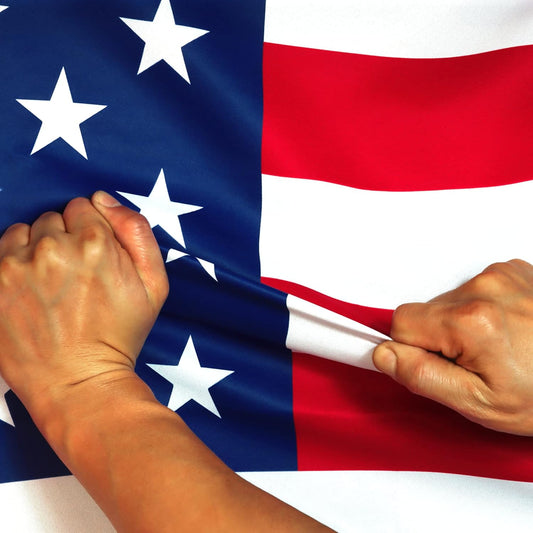 Two hands holding an American flag