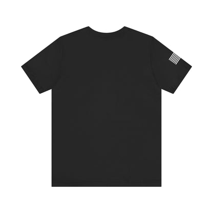 Black t-shirt with a small flag design on the sleeve against a white background
