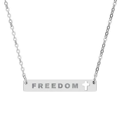 Silver necklace with 'FREEDOM' pendant on a white background