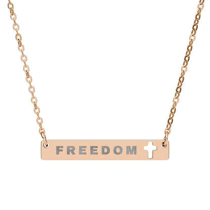 Rose gold necklace with 'FREEDOM' bar pendant on a white background