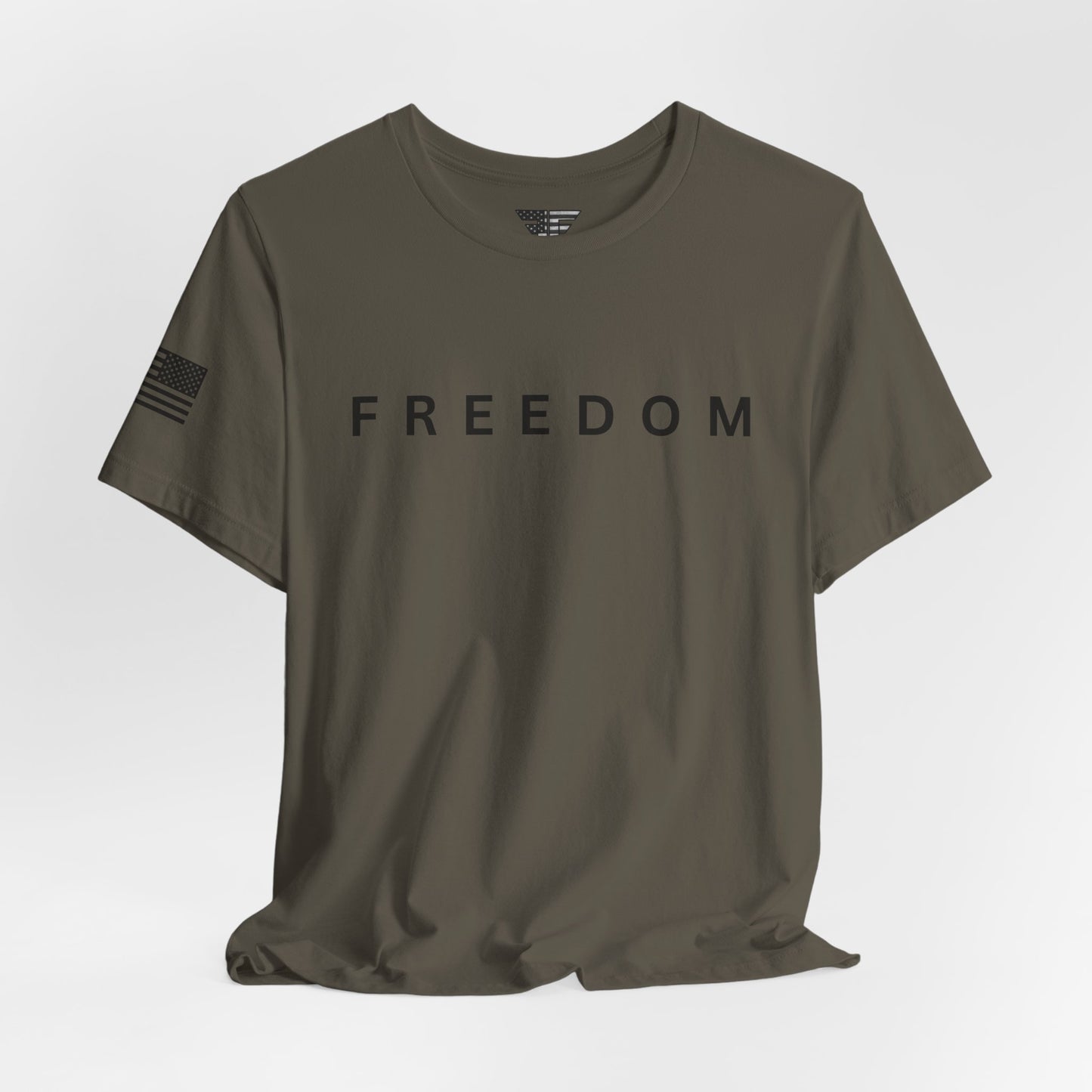 Olive green t-shirt with 'FREEDOM' printed on it against a white background