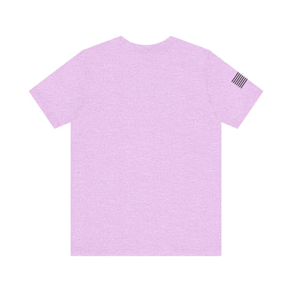 Light purple t-shirt with a small black flag design on the sleeve against a white background