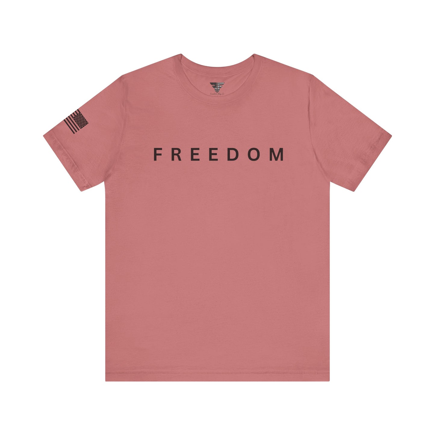 Pink t-shirt with 'FREEDOM' text on a white background