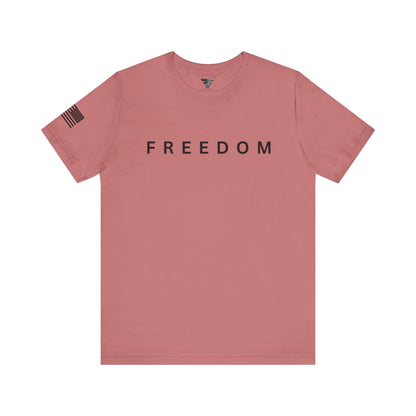 Pink t-shirt with 'FREEDOM' text on a white background