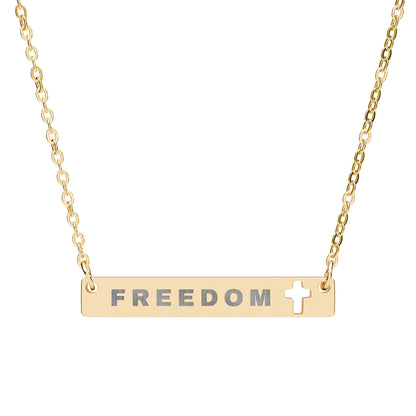 Gold necklace with 'FREEDOM' and a cross symbol on a white background