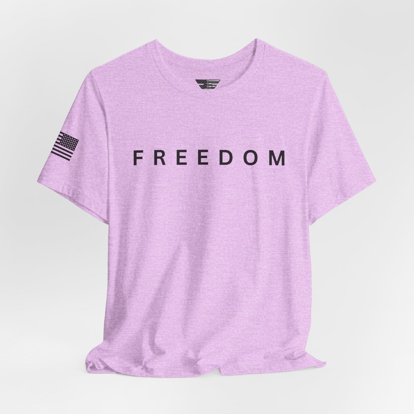 Purple t-shirt with 'FREEDOM' printed on it against a light gray background