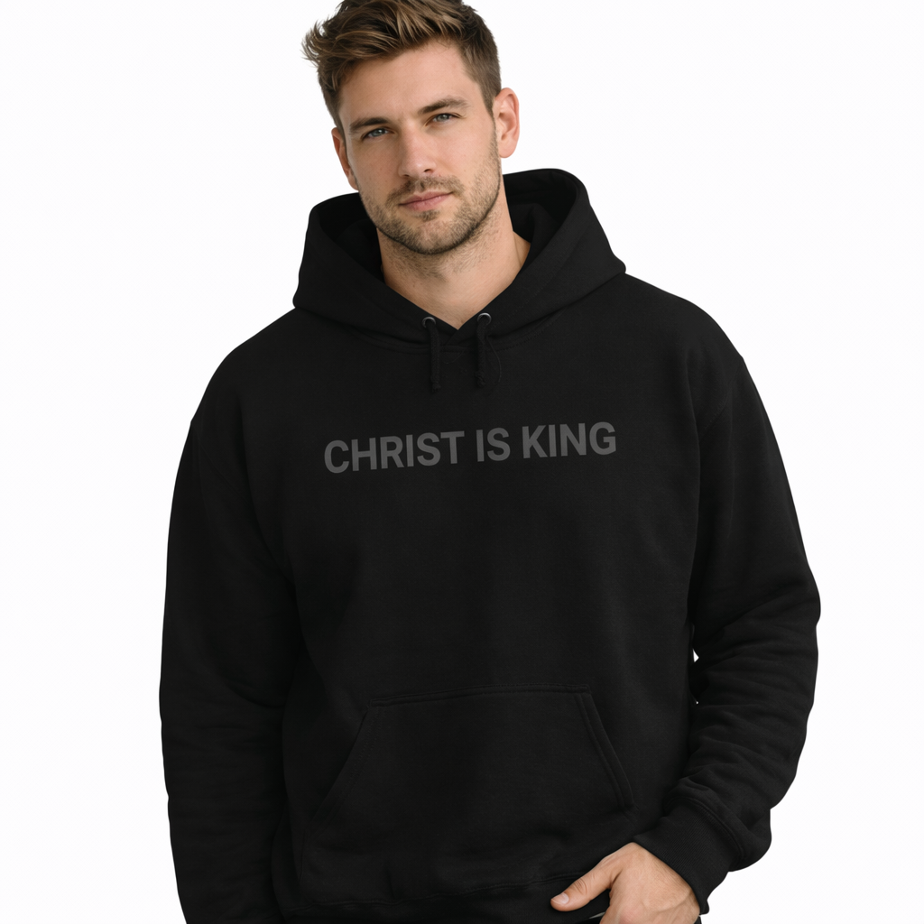 Man wearing a black hoodie with 'CHRIST IS KING' text on a white background