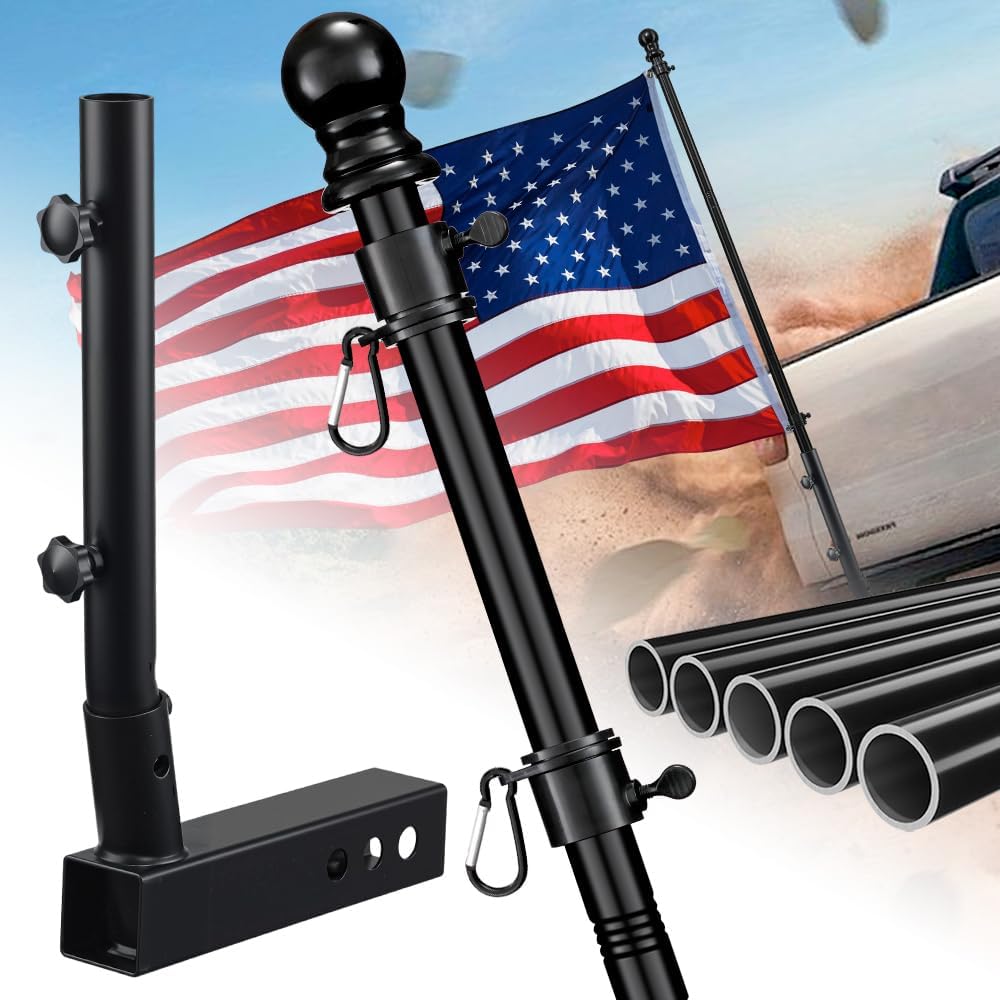 Black flagpole with American flag against a blurred outdoor background