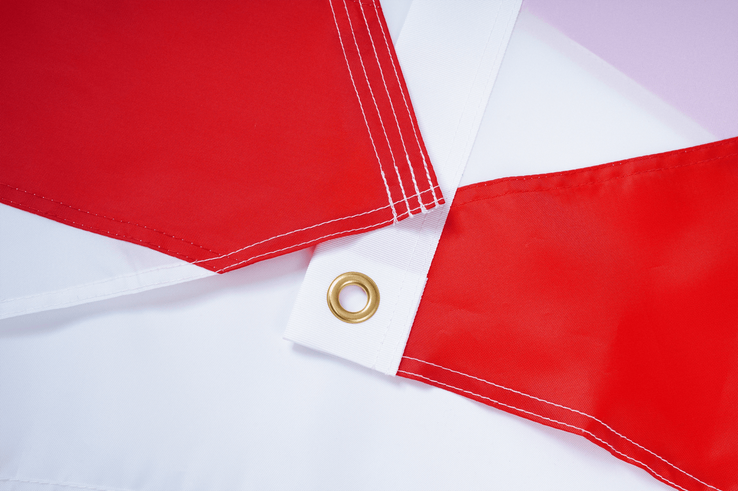 Red flags with grommets on a white background