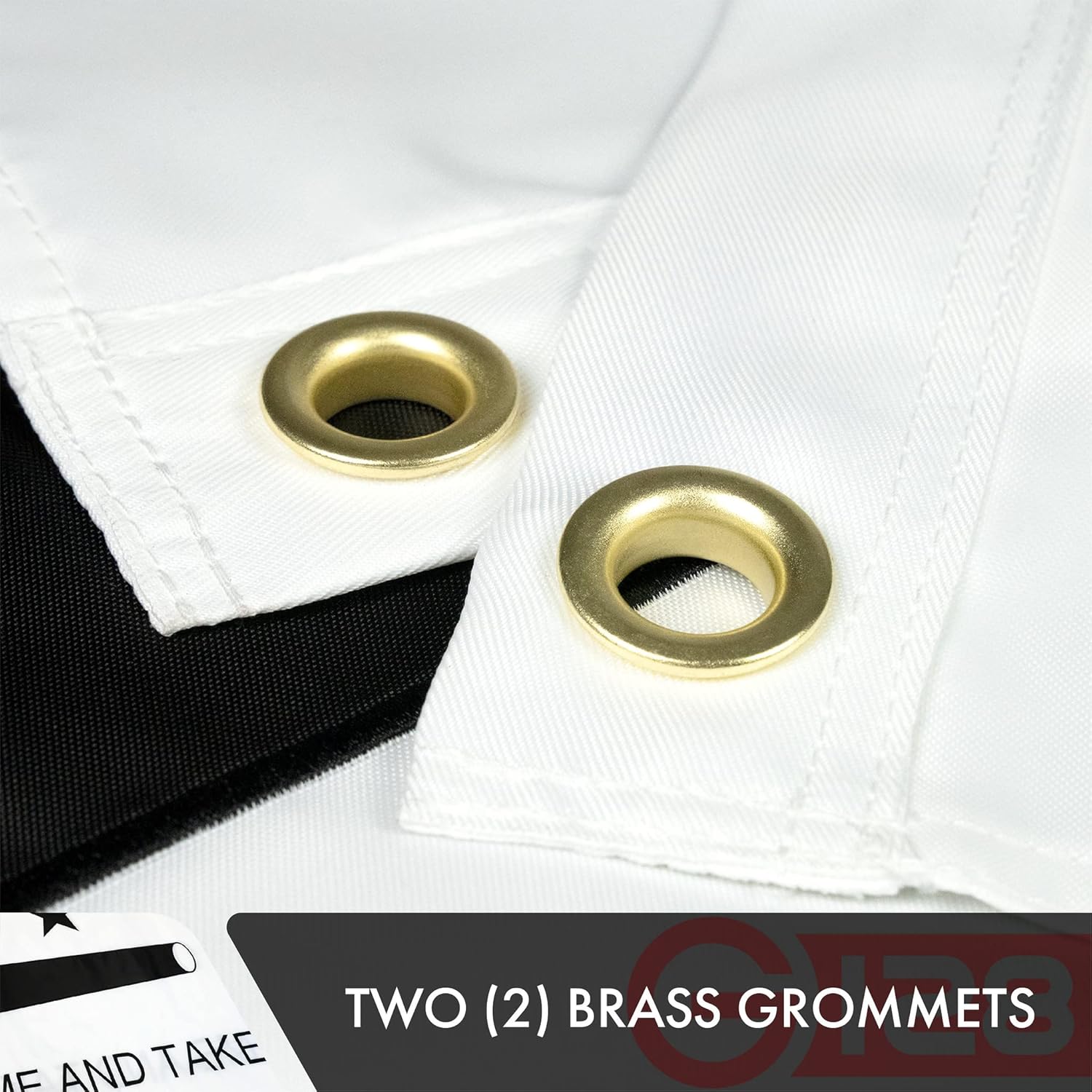 Two brass grommets on a white fabric background with a visible brand logo.