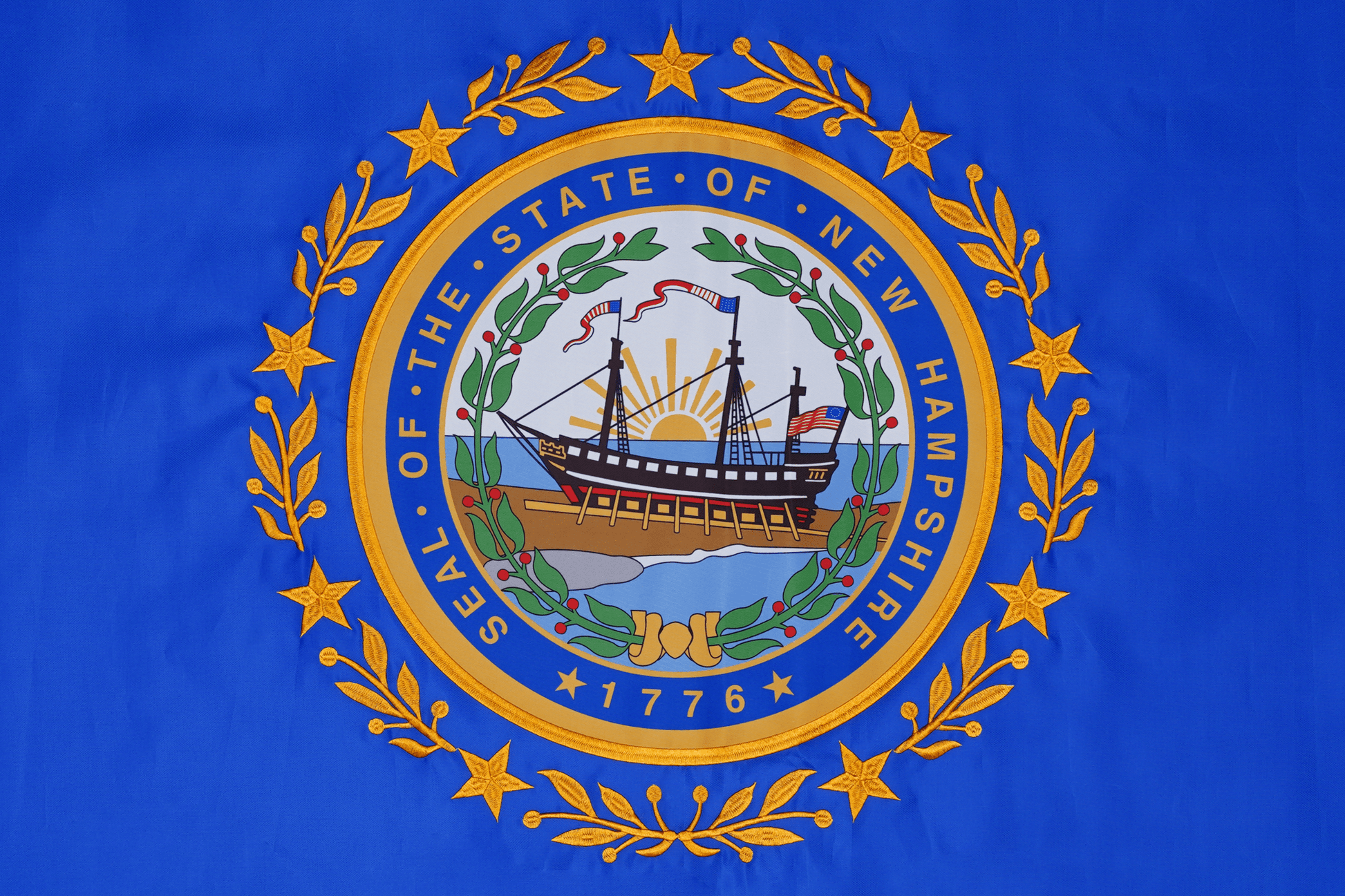 New Hampshire state flag embroidered detail and fabric construction