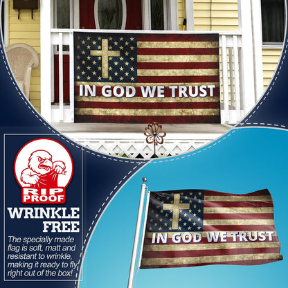 A distressed American flag porch banner with a gold cross and the words 'IN GOD WE TRUST' displayed on a house porch, with additional product graphics showing a wrinkled flag and a blue promotional panel with the Fries Proof brand logo.